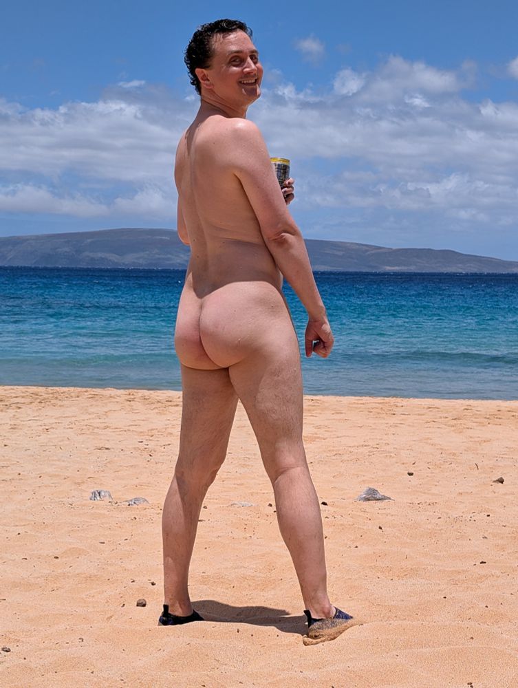 Man showing his ass at the nude beach