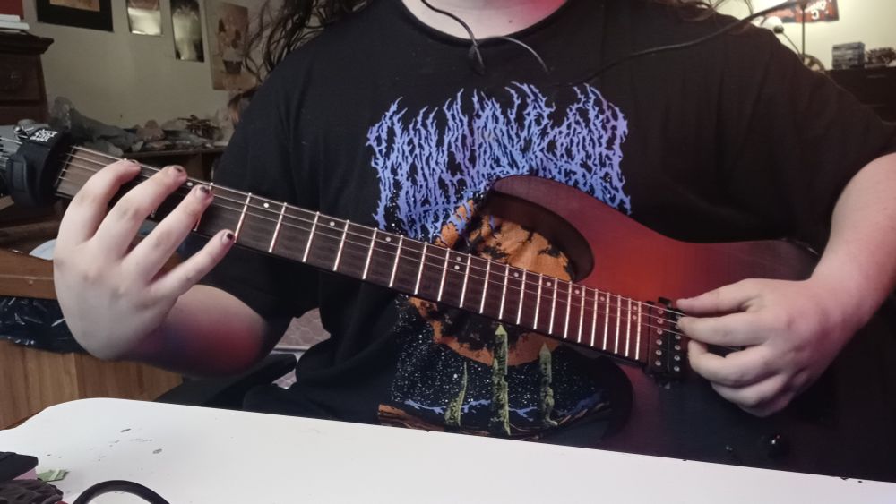 Me holding a guitar