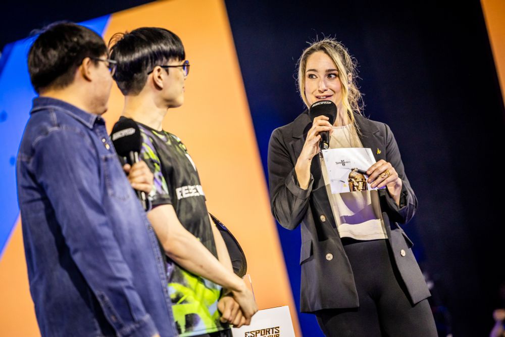 Rachel on stage with translator Maddox interviewing Byun