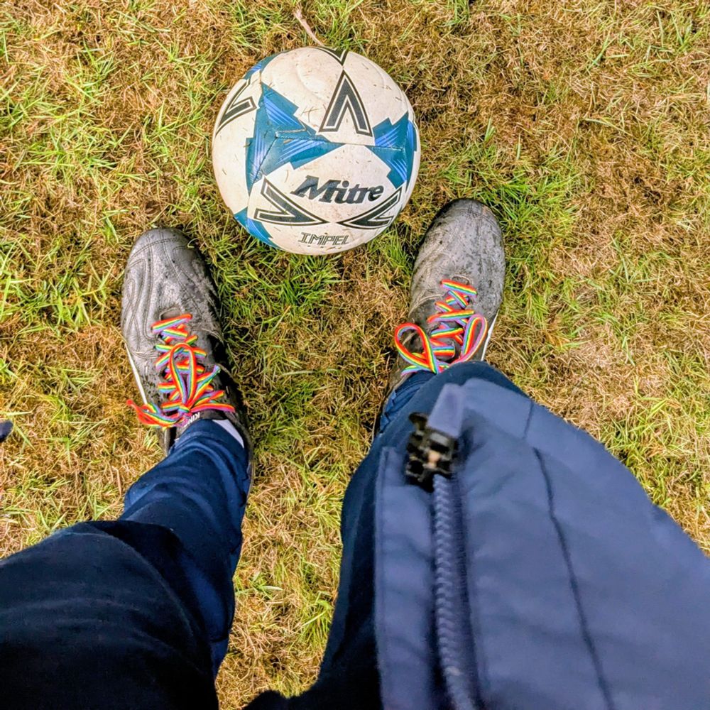 Football boots and a ball on a damp field in Lincolnshire