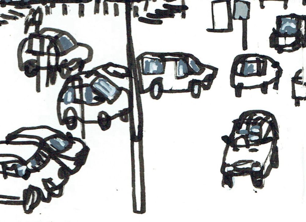 A detail of a drawing in black ink showing a car park in front of a railway station. 