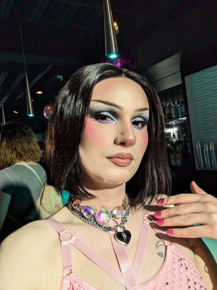 Lyra in a dark middle part bob in the dance floor of play sheltering in place