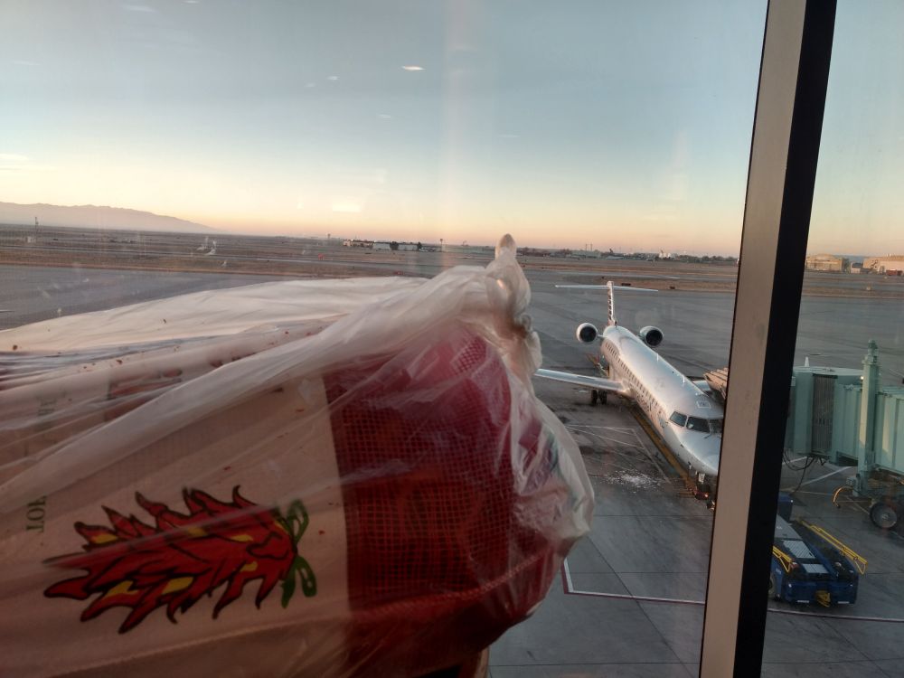 A giant bag of chilies with an Alaska Airlines plane in the background