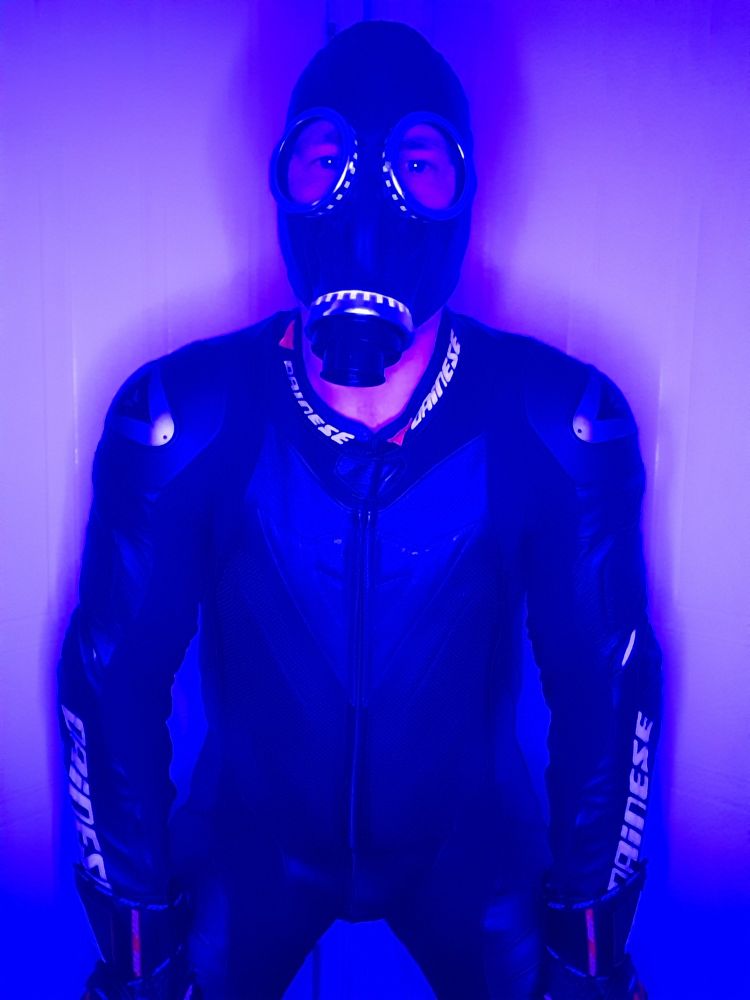 Dainese biker wearing Dainese leathers and GP5 gas mask.