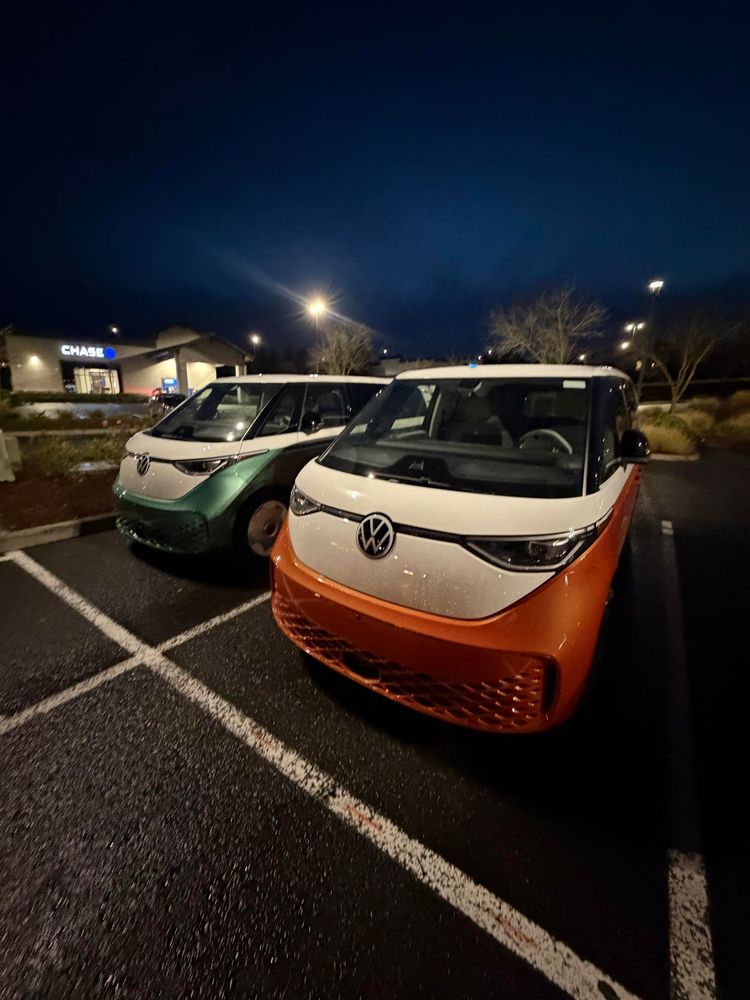 A mint green VW ID. Buzz parked next to my orange ID. Buzz