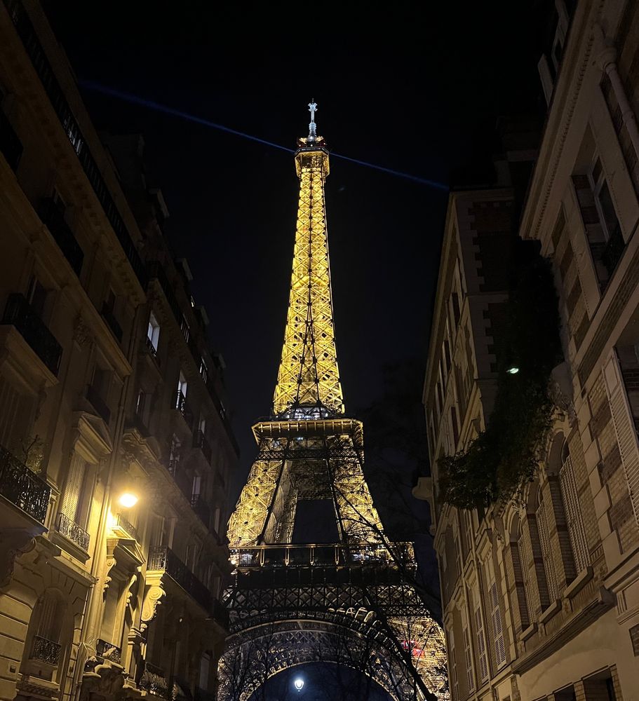 Eiffel Tower at night, lit up 