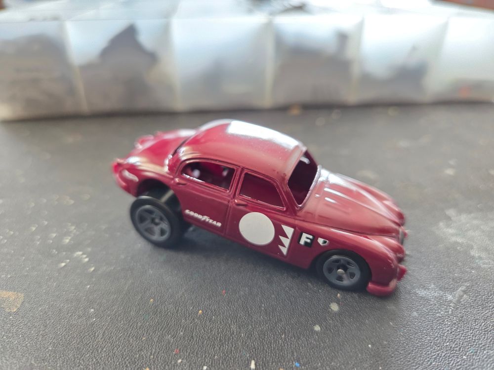 A Hot Wheels Jaguar with dragster tires