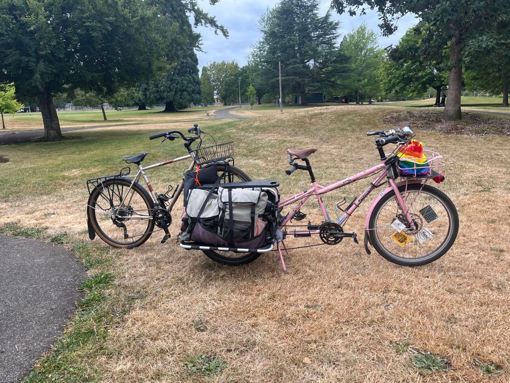 A Surly Big Dummy longtail cargo bike with a regular bike’s front wheel tucked into cargo bag