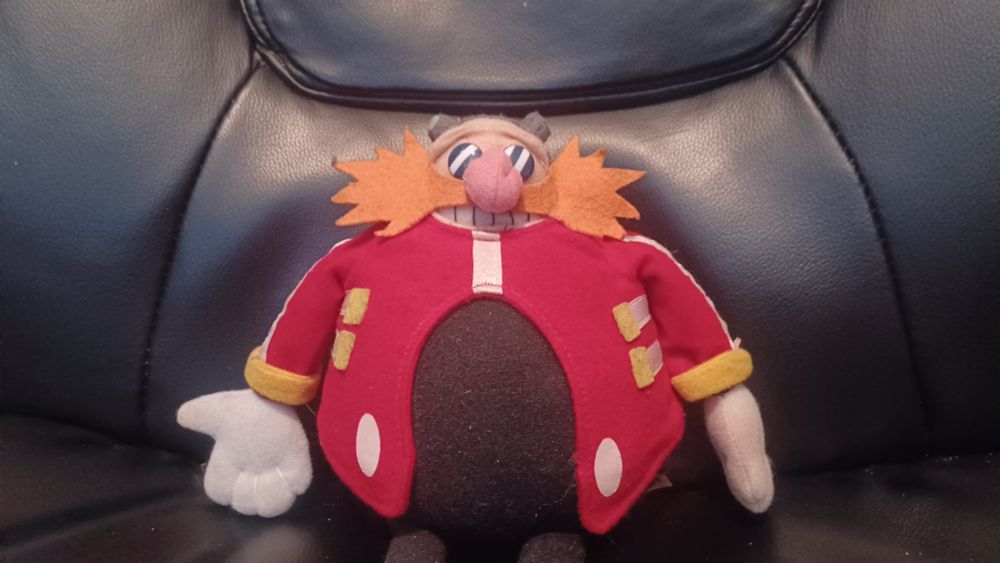 An Eggman plush, sitting in a computer chair.