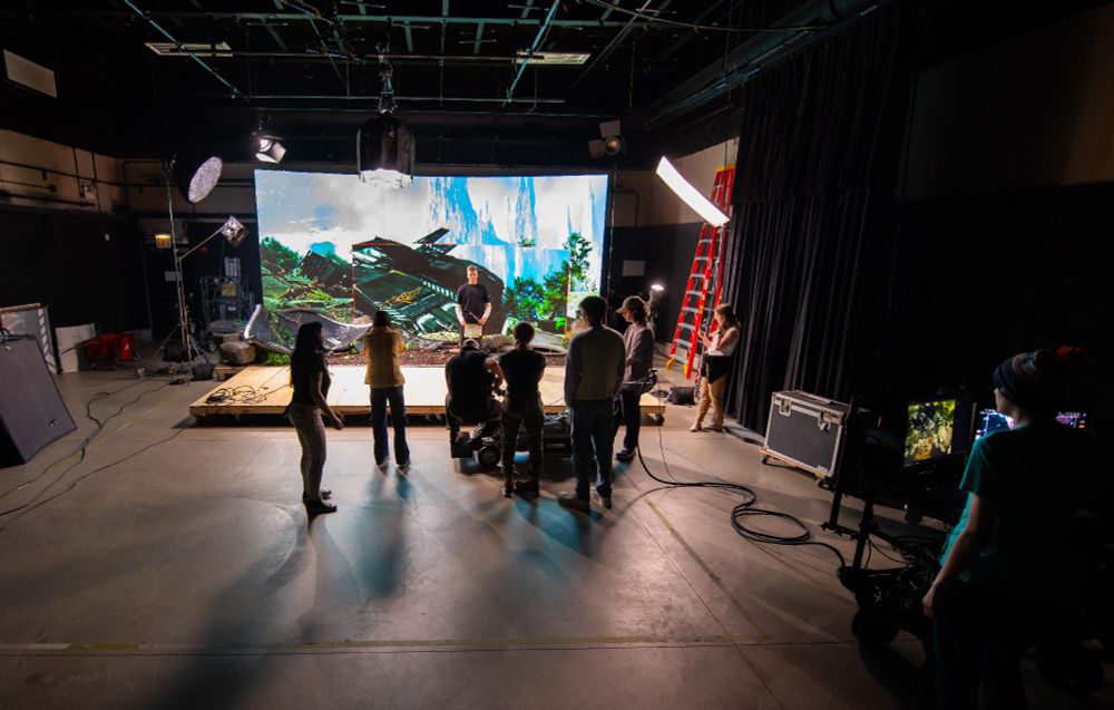 A group of students on a virtual production student film set.