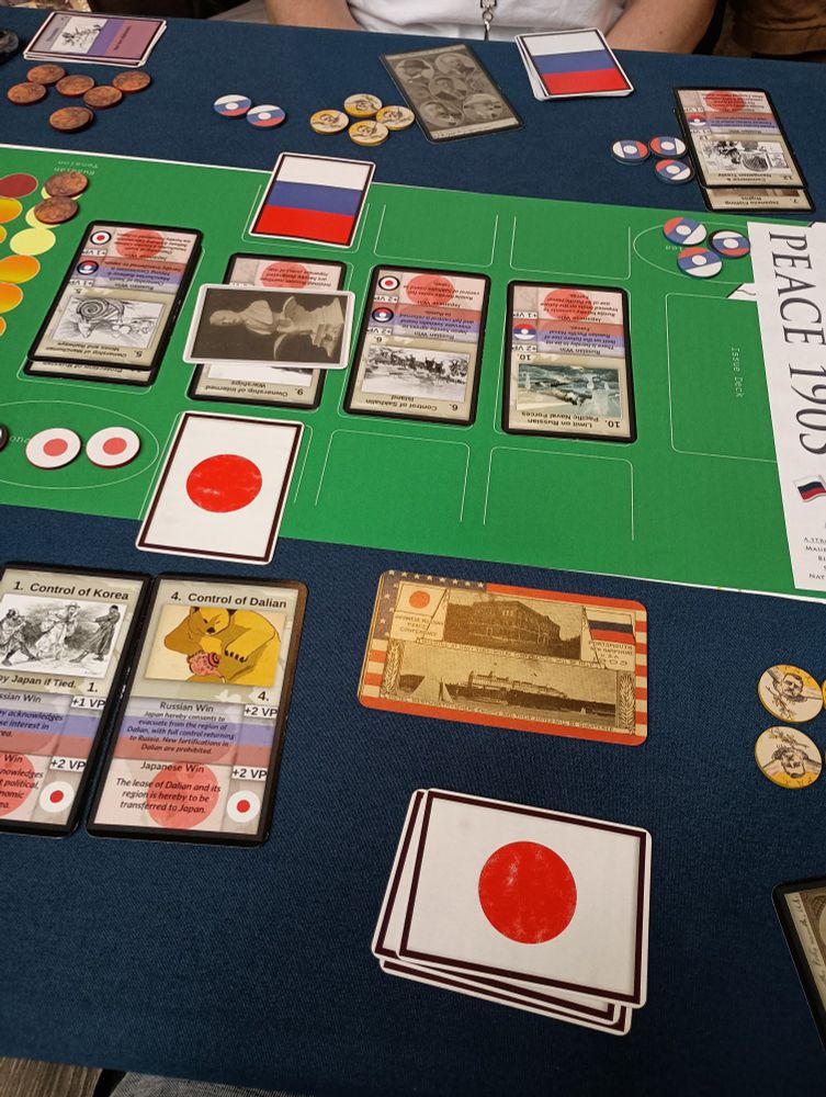 Peace 1905 card game laid out on a table.