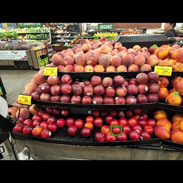 a photo of a bunch of round fruit at a grocery store. one of them is highlighted as a penis, and spots on two others are marked as nipples 