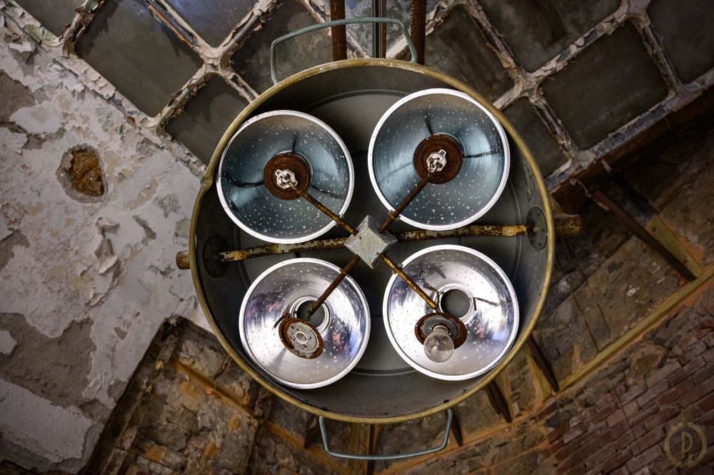 A set of surgical lights hung from the ceiling of an abandoned surgery room inside Eastern State Penitentiary,  Philadelphia, PA.