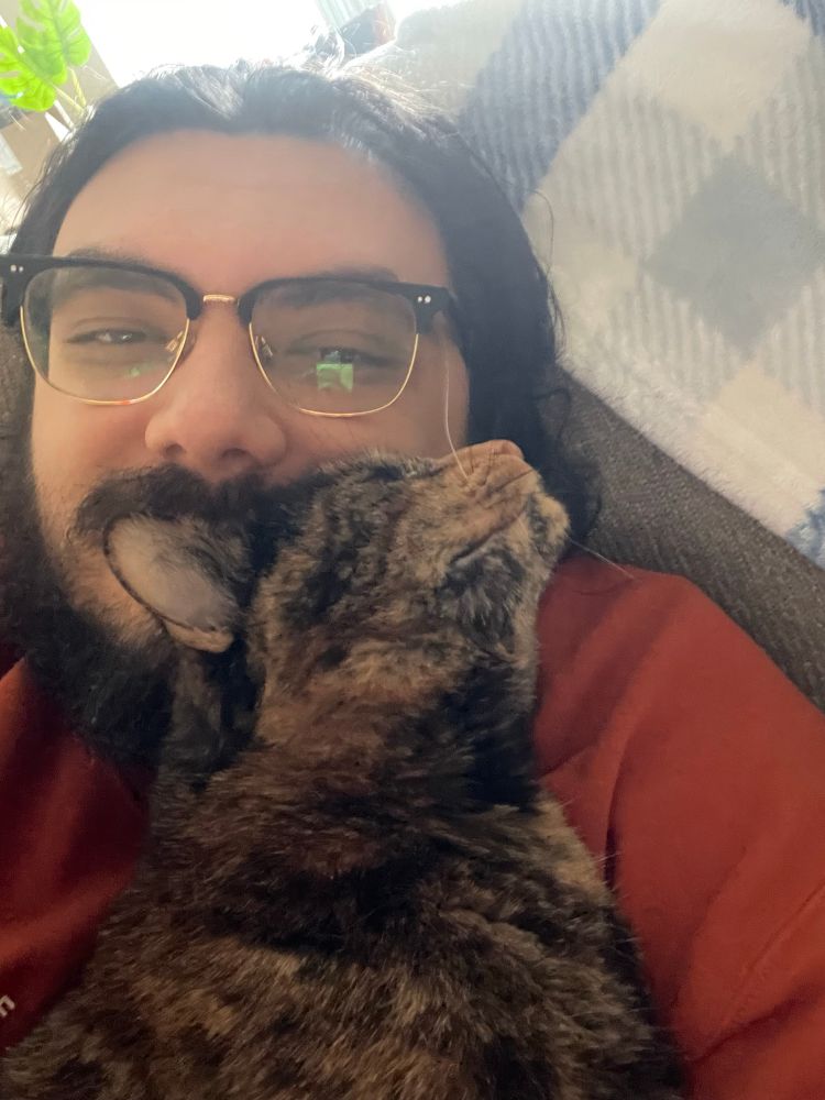 Cuddling my cat Noodles