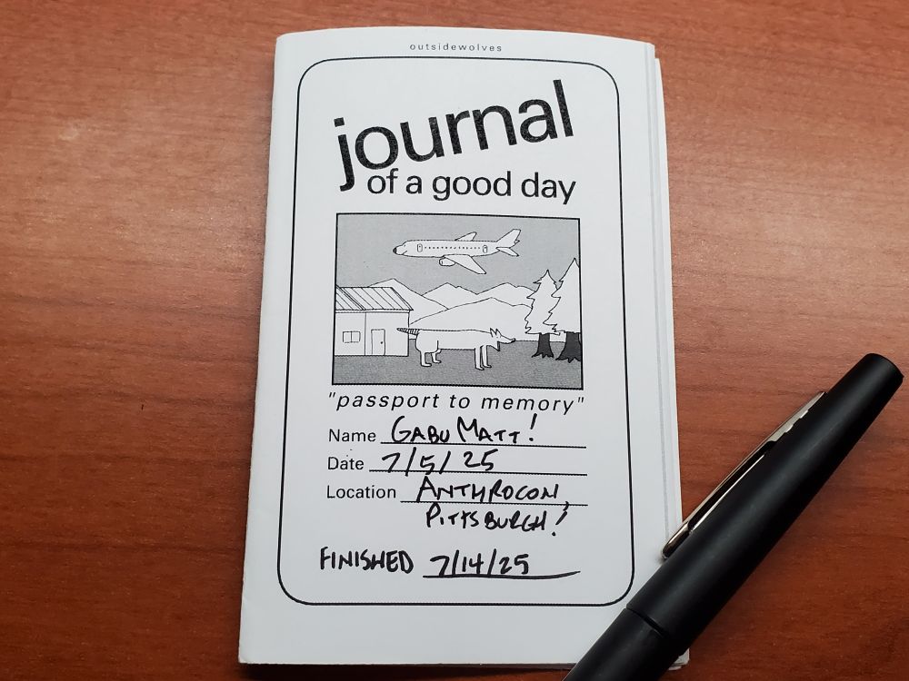 Cover of a one page zine "journal of a good day" format by outsidewolves. Format has a happy anthropomorphic plane and a quadrupedal animal next to a house and trees and mountains. "Passport to memory" name: GabuMatt! Date: 7/5/25 Location: Anthrocon! Pittsburgh! And I added finished: 7/14/2025