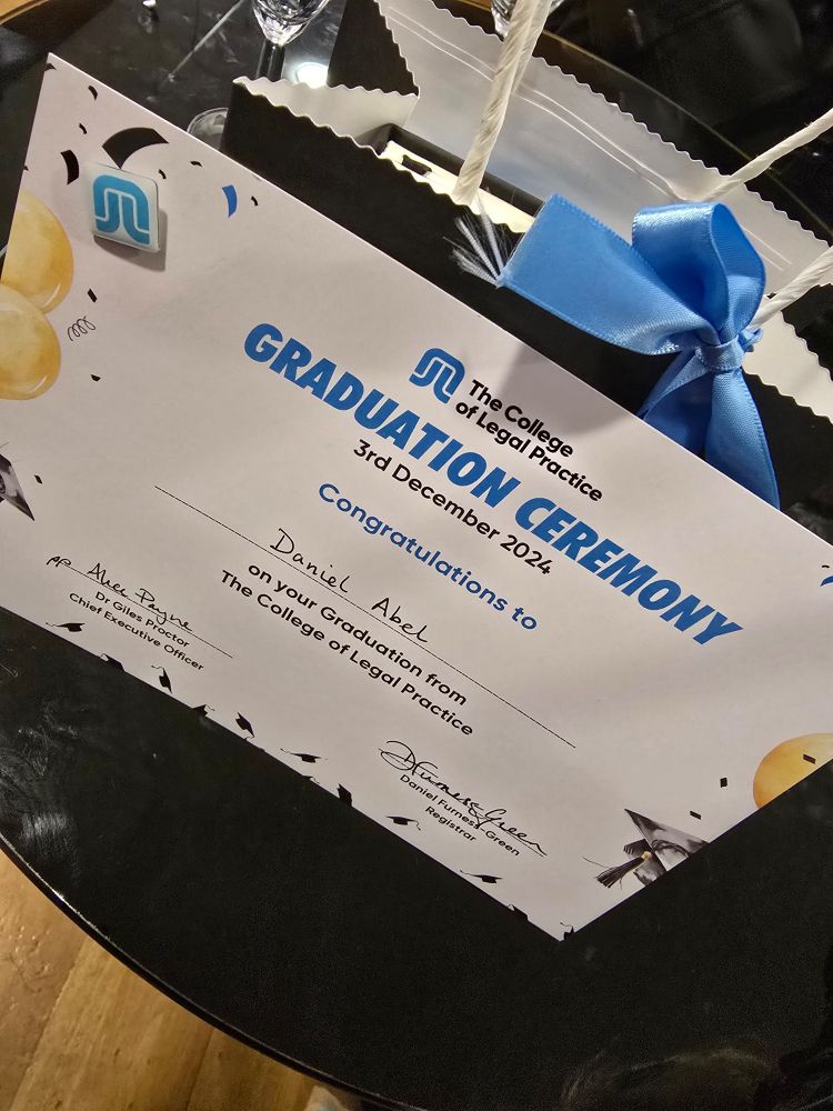 Photo of certificate reading "Graduation Ceremony. 3rd December 2024. Congratulations to Daniel Abel on your Graduation from The College of Legal Practice". 