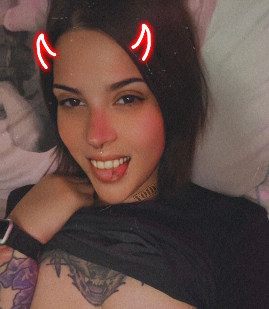 Void in a selfie pulling up their top and flashing my the camera but the photo is cut off 