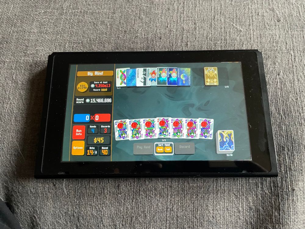 A Nintendo Switch screen with no attached Joycons, showing a game of Balatro