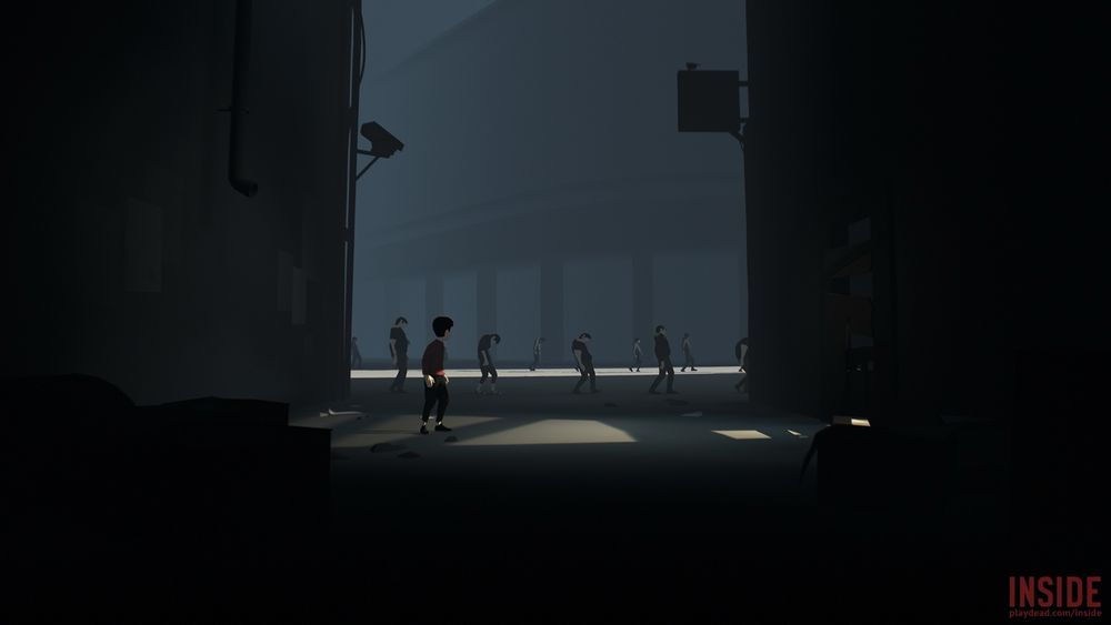 screenshot from the video game INSIDE by Playdead. The player character, an unnamed boy, is in the foreground, watching a group of slumbering people, lined up and walking under the gaze of a security camera