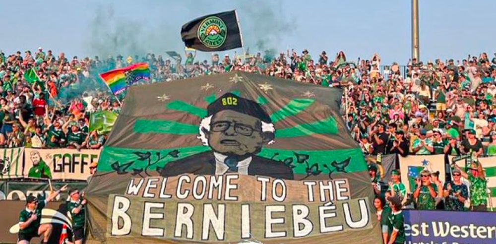 larly football (soccer), "tifo" refers to a large, coordinated visual display, often involving banners, flags, and other elements, created by fans to show support for their team. This one is of Bernard Sanders of Vermont and held up ahead of Vermont Greens recent soccer final.  