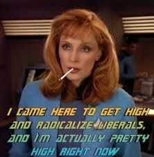 Blazin Beverly Crusher, The hot red-headed doctor from Star Trek the next generation there is a joint photoshopped into her mouth with text that says "I came here to get high and radicalized liberals and I'm actually pretty high right now. "