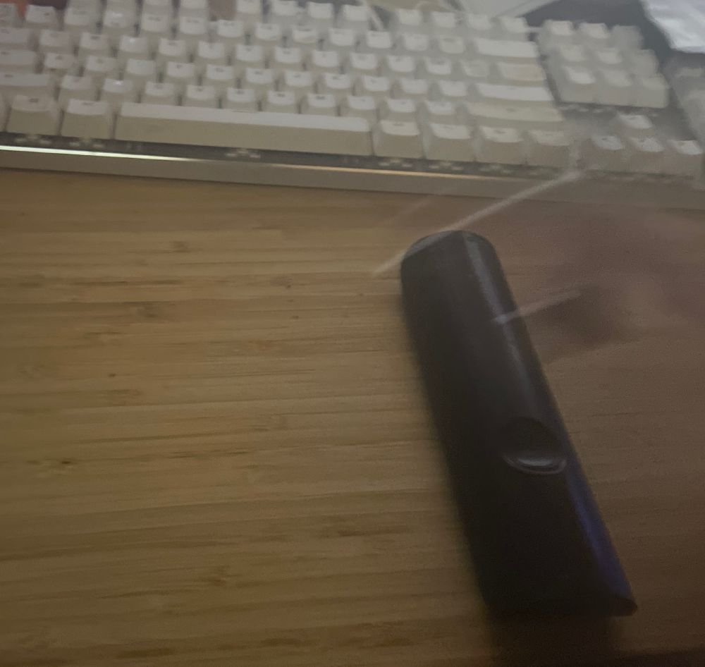 The fingerboard being jumped over a tv remote