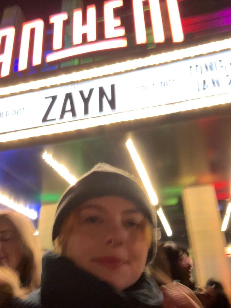 Post-concert me, once again cold, trying to get a selfie in an ever moving crowd 