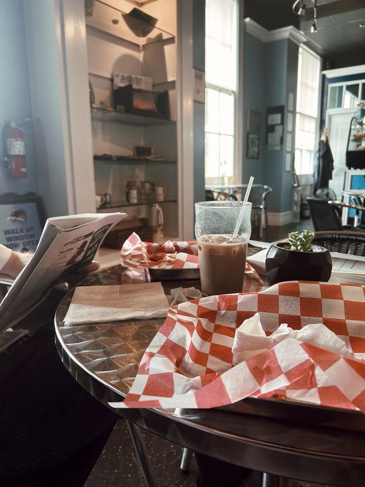 Cafe table filled with trays and chai