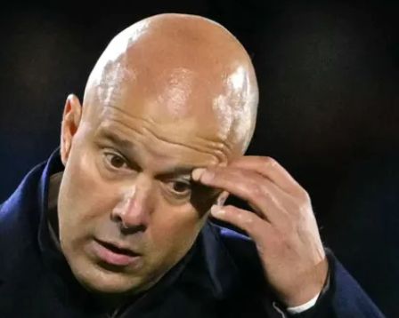 arne slot scratching his eyebrow and looking lost