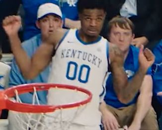 Otea Oweh reacts to Collin Chandler's dunk.