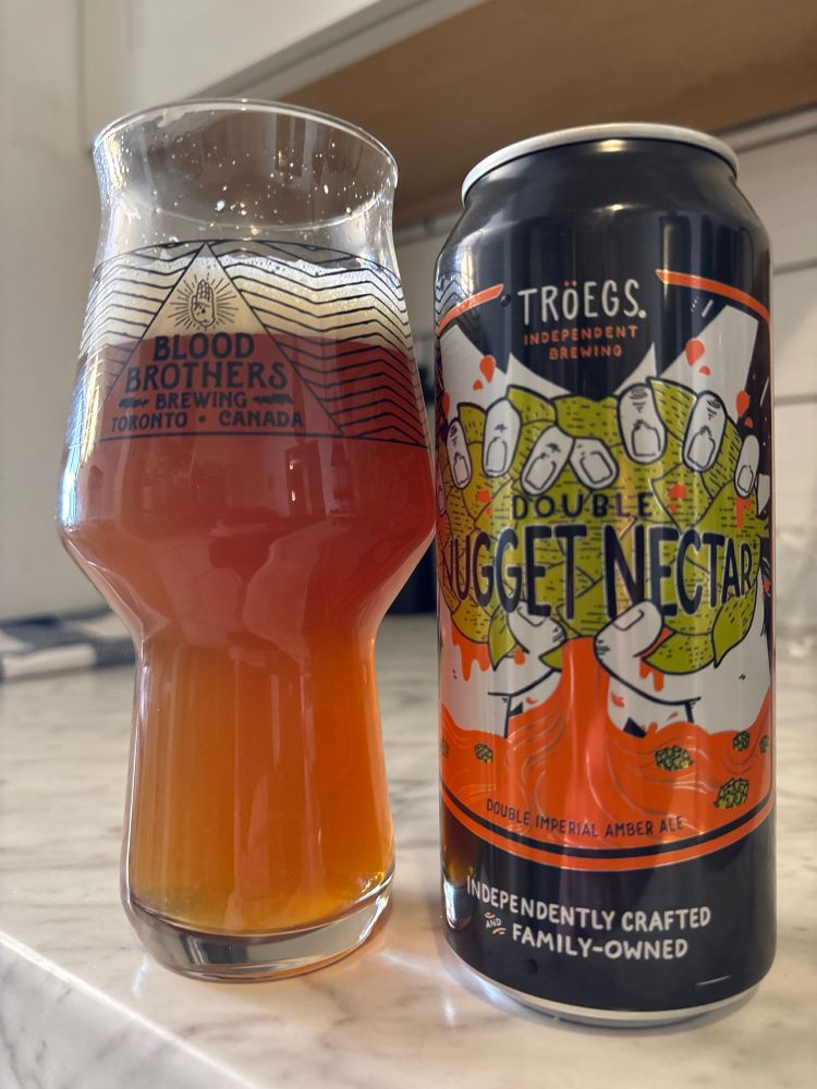 Troegs Brewing Double Nugget Nectar poured into glass. 