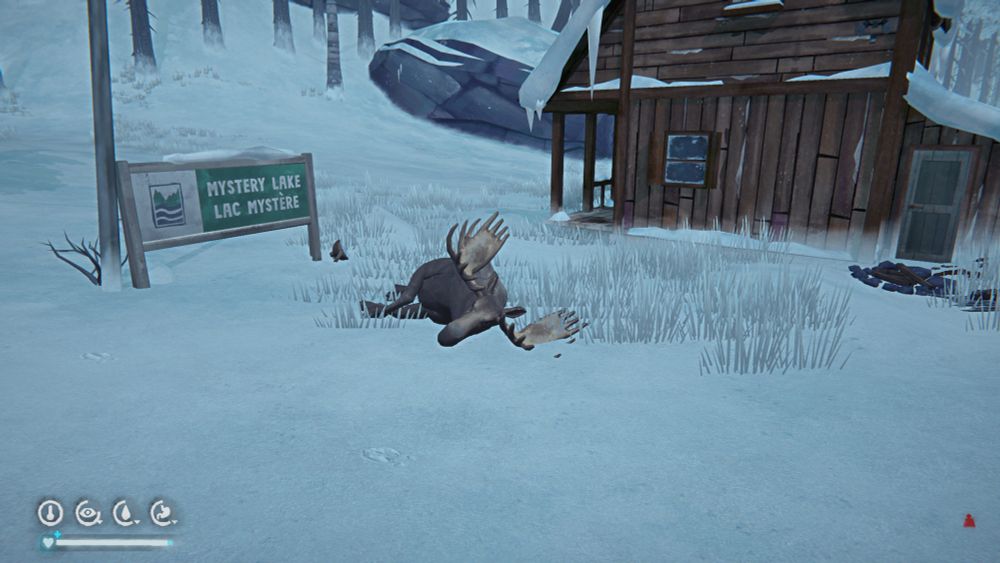 Screen shot from the video game The Long Dark, showing a dead moose in front of a cabin