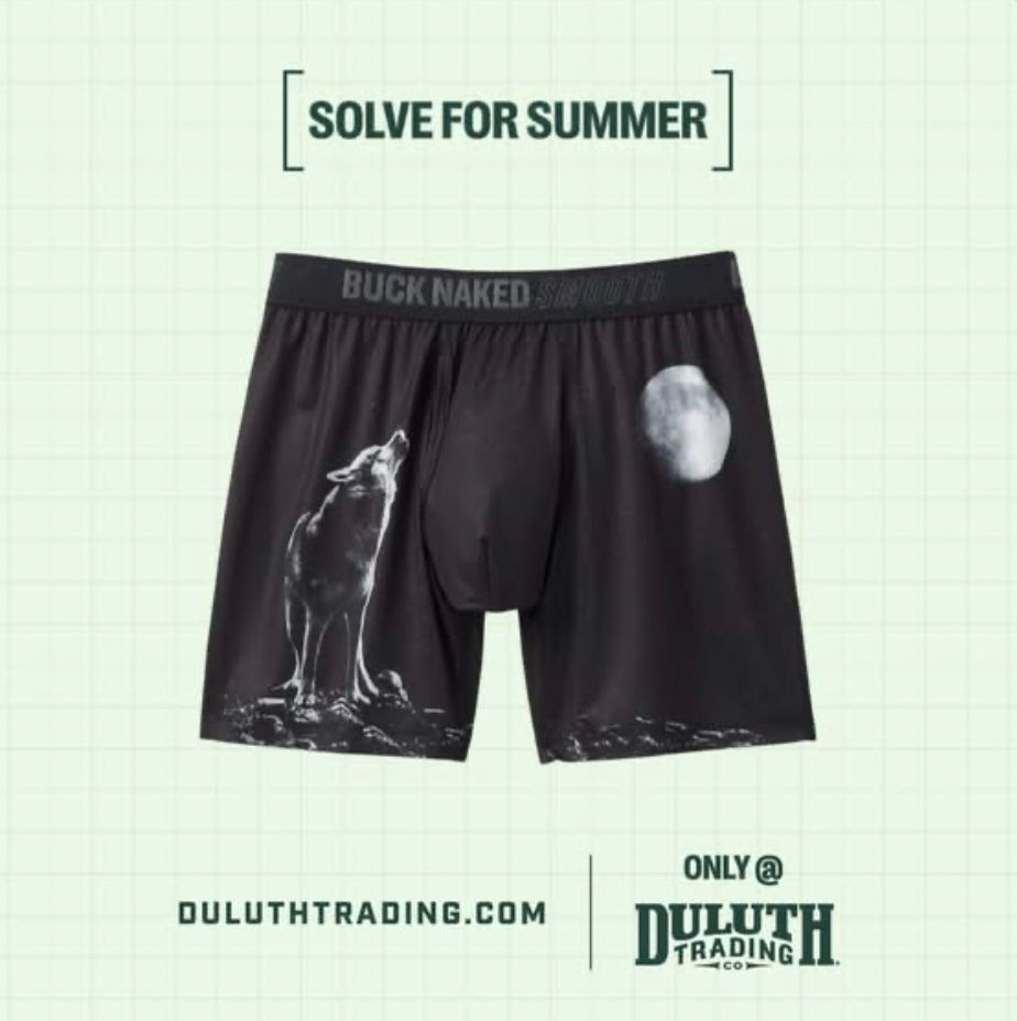 A pair of men’s black boxers from Duluth Trading with white images of a wolf and moon but on first glance the white images look like cum stains.