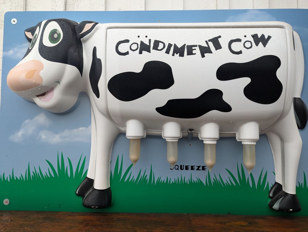 A "condiment cow" whose udders look suspiciously like used condoms.