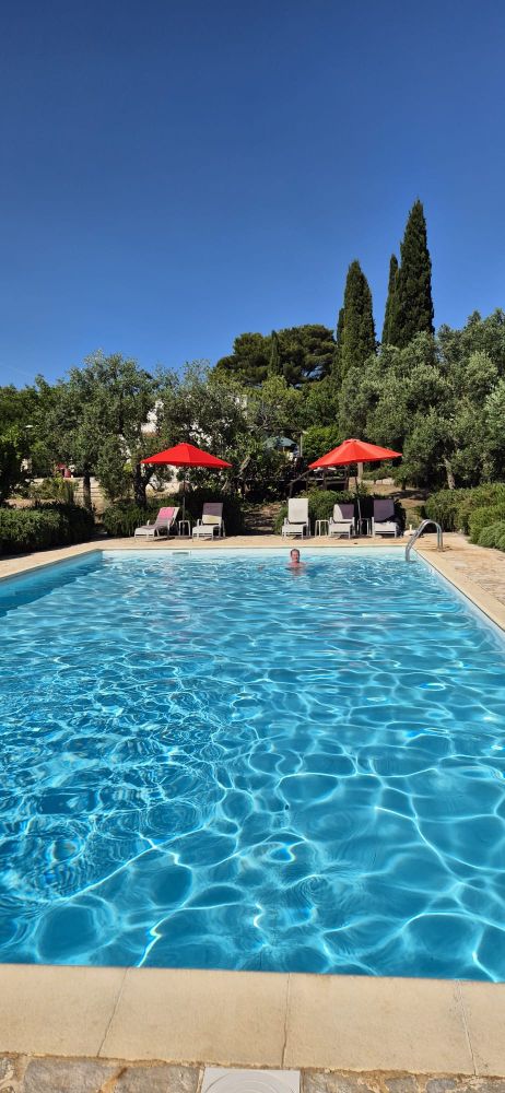Outdoor swimming pool in the sun.