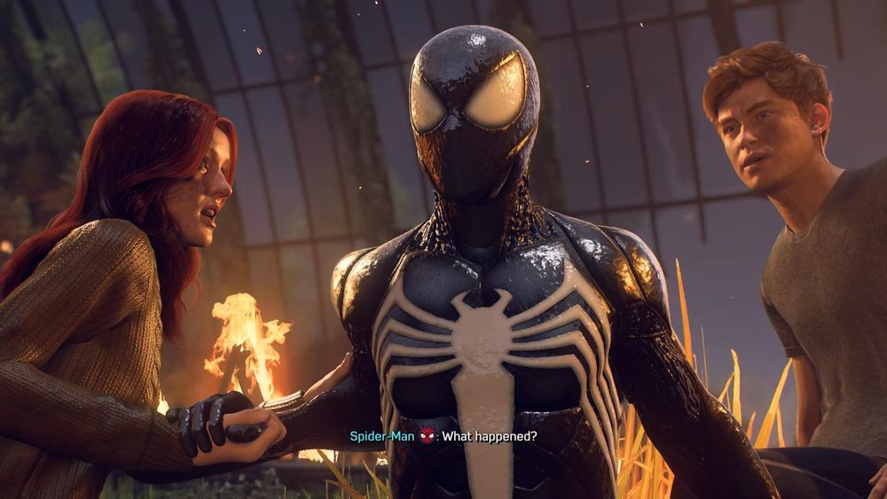 Spider-man sitting up wearing the venom suit. Mj is on the left and harry is on the right. Spider-man is asking "what happened?"