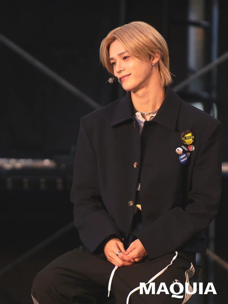 k andteam sitting with hands clasped and smiling