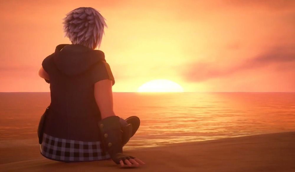 Riku from Kingdom Hearts III, sitting on a beach at sunset