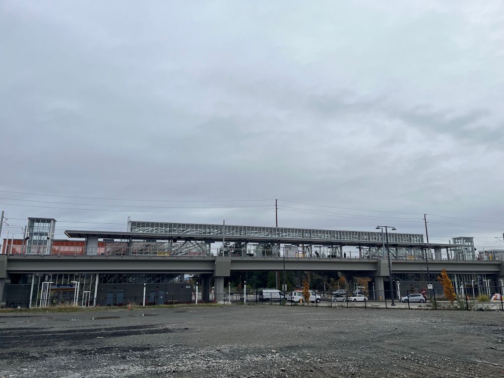 Kent Des Moines station. Empty gravel lot is in the foreground. 