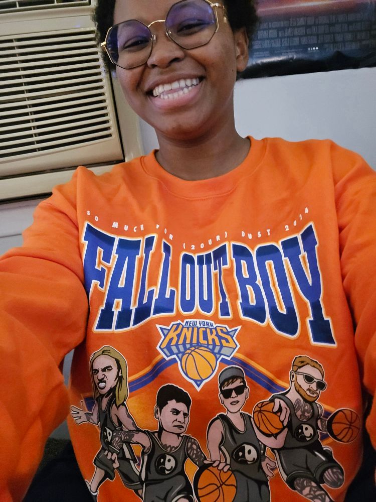 Anise wearing her Knicks X Fall Out Boy sweatshirt 