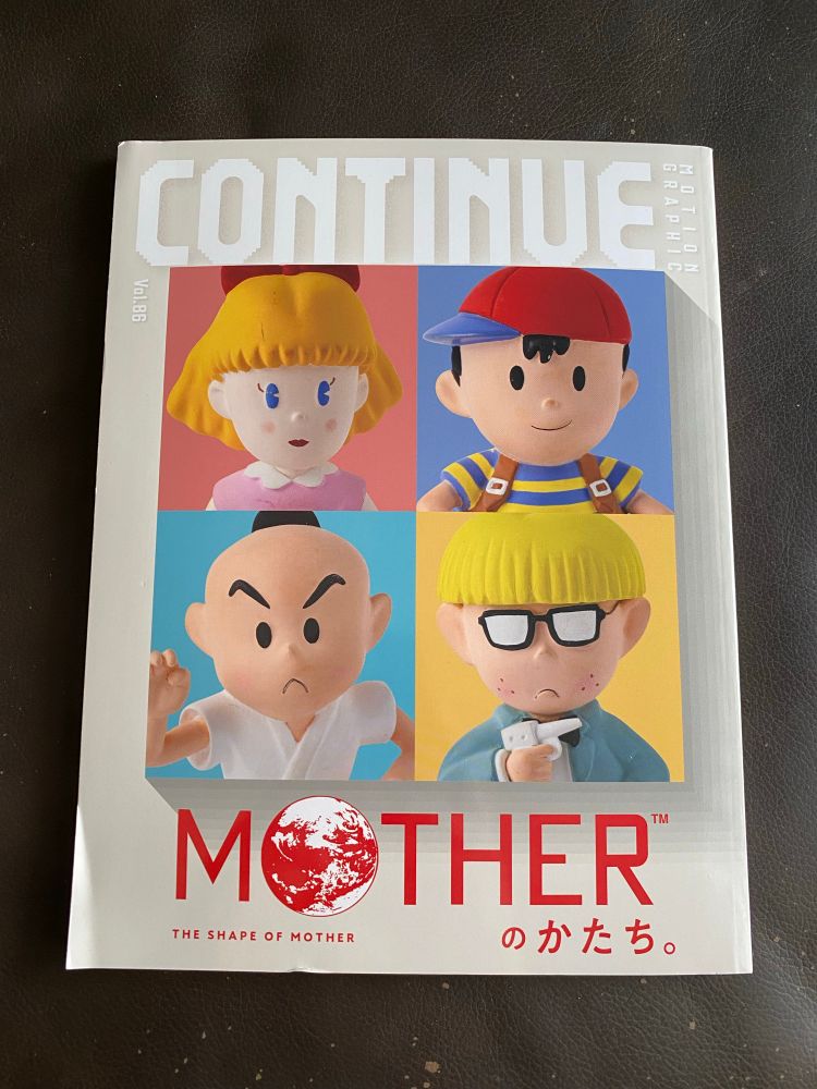 Continue 86 cover featuring the faces of Paula, Ness, Poo, and Jeff’s clay figures