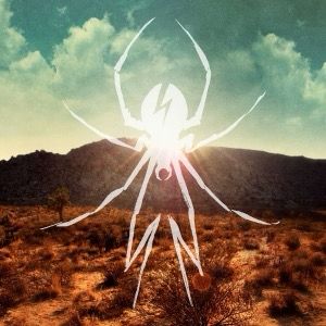 A white spider symbol overlays a desert scene with arid vegetation under a partly cloudy sky. The sun peeks from behind hills, casting a warm glow.