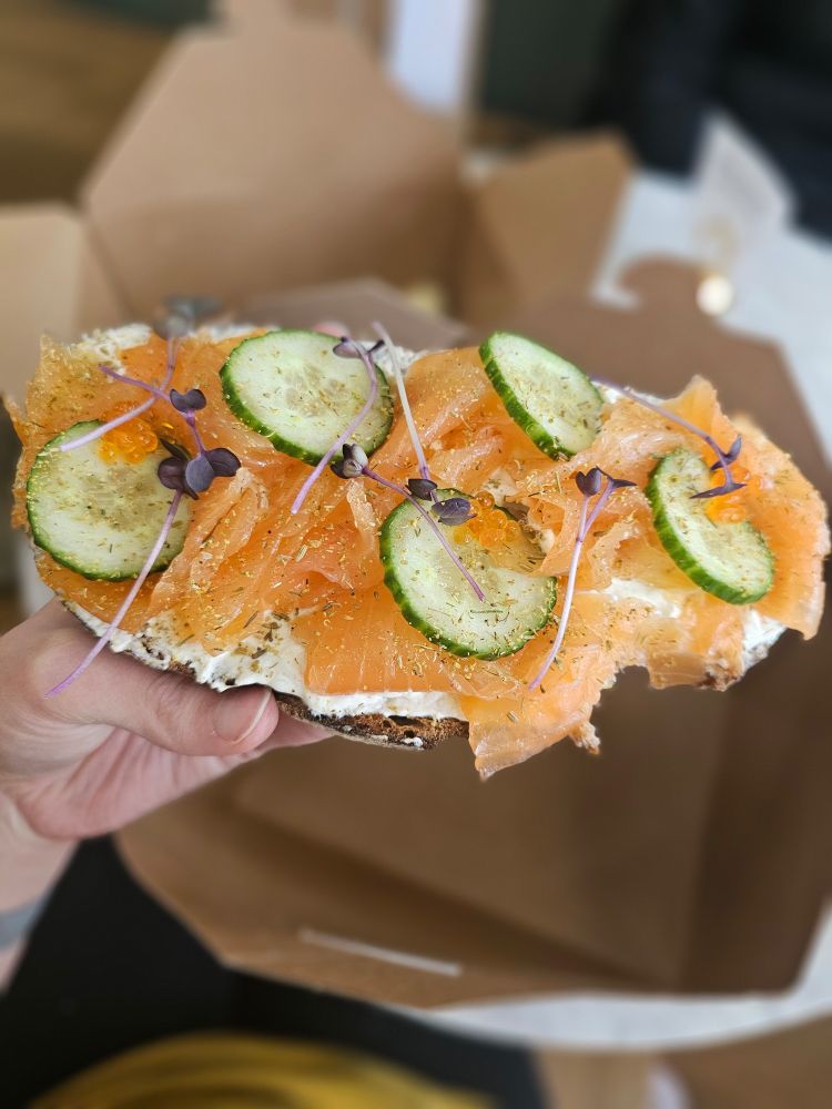 Salmon on toast with capers, cucumber, and herbs