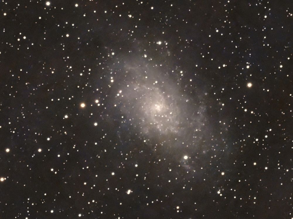 The Triangulum Galaxy has a diameter of about 61,100 light-years  making it roughly 70% the size of the Milky Way.

Estimates for its distance from the Milky Way range from 2.38 to 3.07 million light-years, with recent estimates typically around 2.7 to 2.8 million light-years.

Astronomers believe the Triangulum Galaxy could become involved in the predicted collision between the Andromeda and Milky Way galaxies over 4 billion years from now!