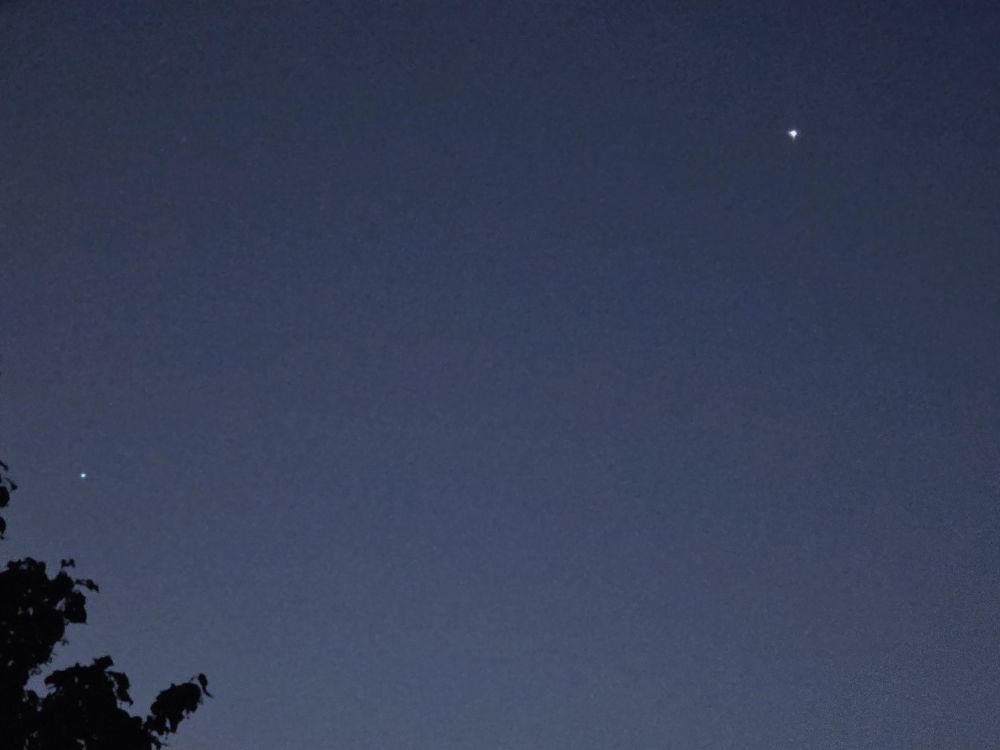 Jupiter is lower left. Venus was much brighter. Imaged captured by my phone hand held through a closed upstairs window!