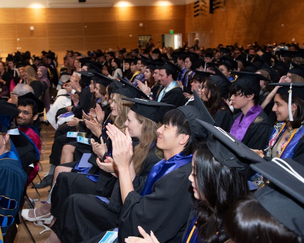 Husky grads at the Jackson School of International Studies graduation ceremony in the Husky Union Building on the University of Washington Seattle campus