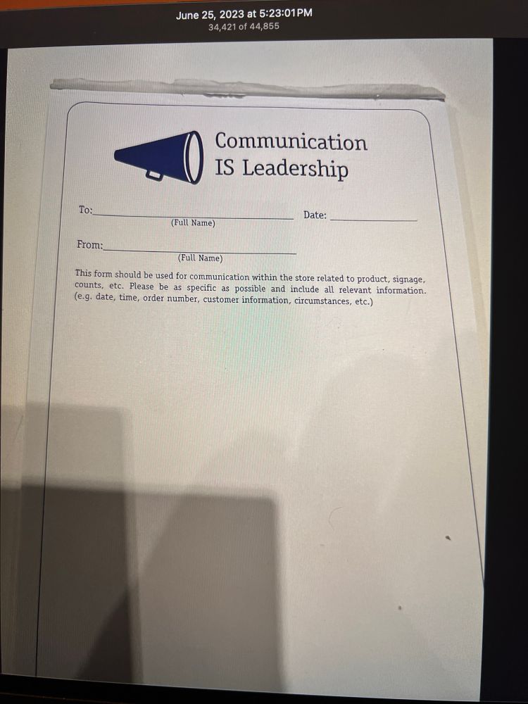 Notepad that reads “Communication IS Leadership”