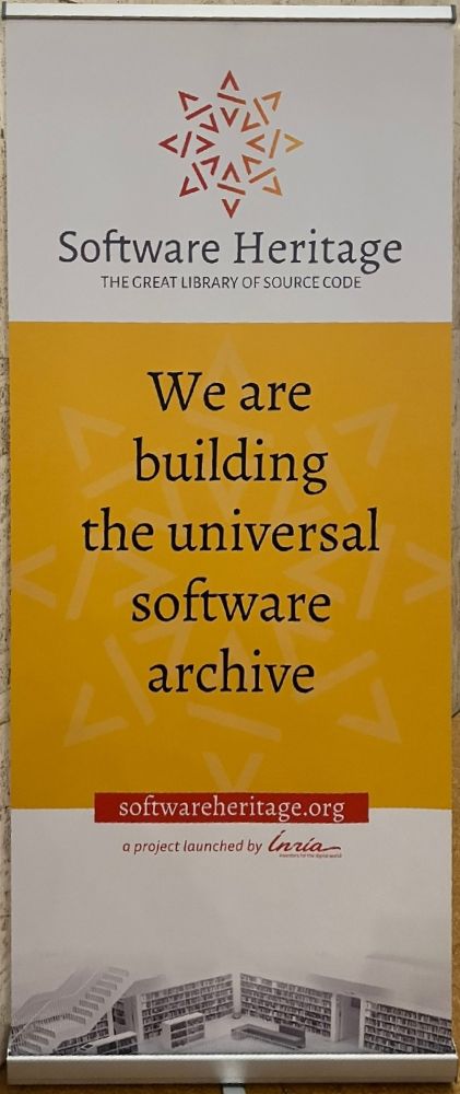 A vertical banner for Software Heritage, labelled "The Great Library of Source Code." It features a yellow and white background with an abstract geometric logo at the top. The text reads, "We are building the universal software archive." At the bottom, the URL softwareheritage.org and "a project launched by Inria" are displayed, accompanied by the Inria logo. An image of bookshelves is subtly integrated into the lower part of the banner.

