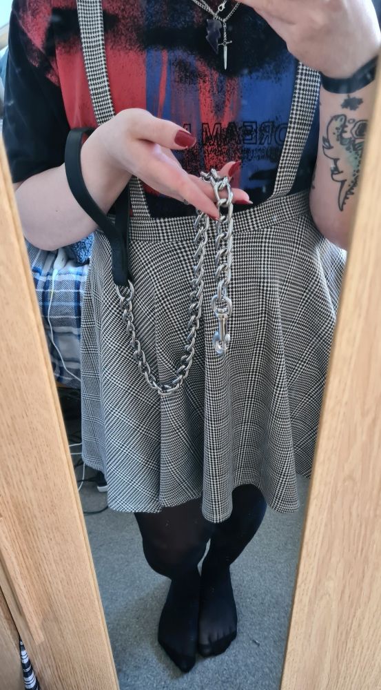 Olivia in the mirror. Full body shot with only her face not visible. In her hand is a heavy duty chain leash. 

You wish it was fastened to you, don't you? Wouldn't things be easier if you were collared at her feet?