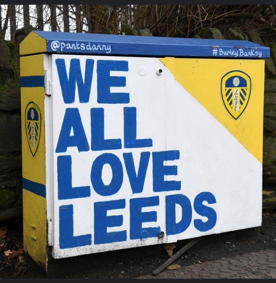 A sign saying we all love Leeds 